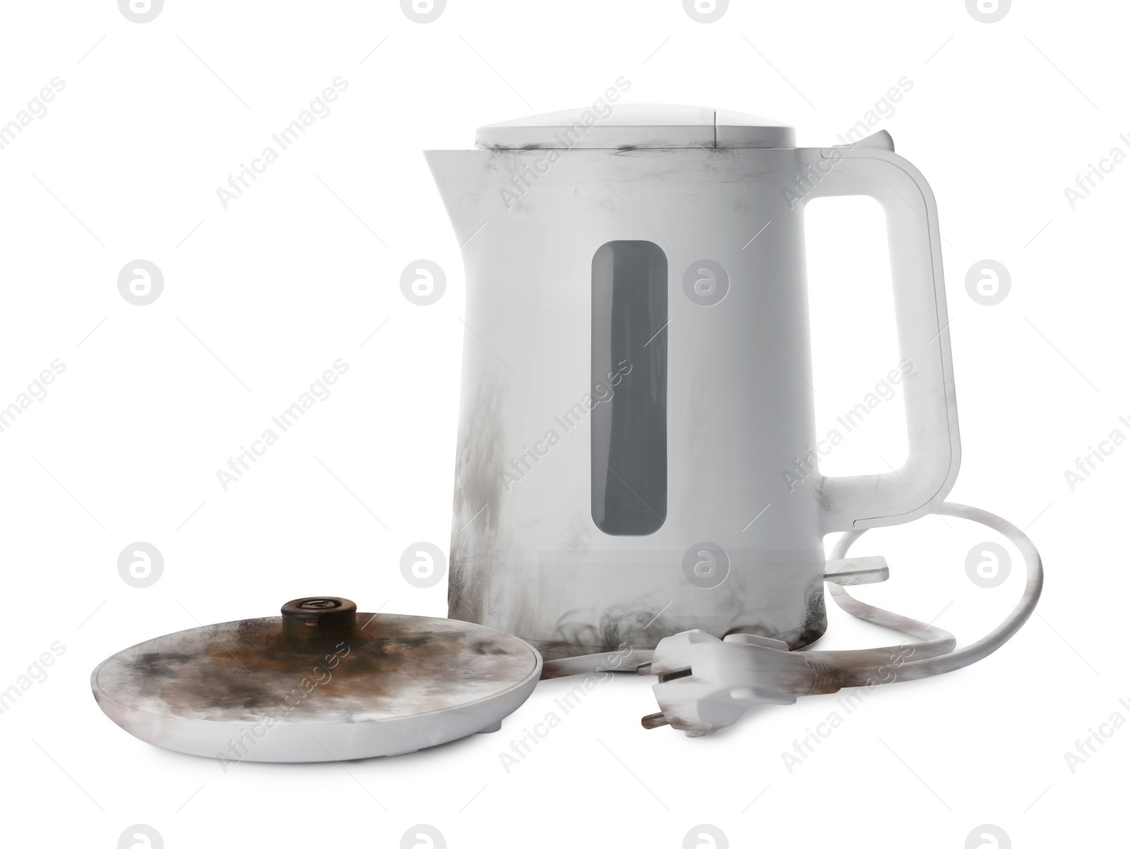 Image of Burnt electric kettle with base and plug on white background