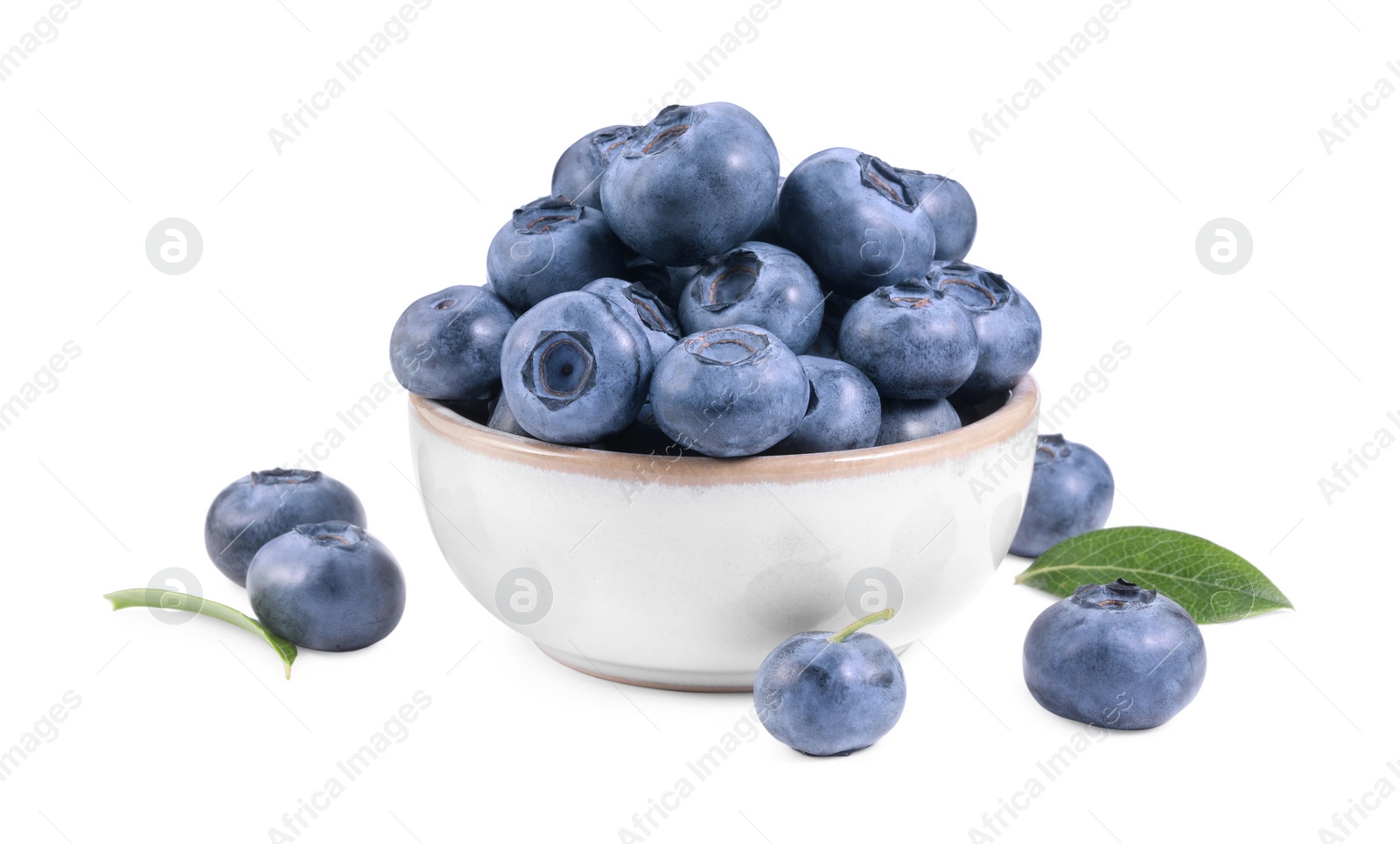 Photo of Fresh ripe blueberries and leaves isolated on white