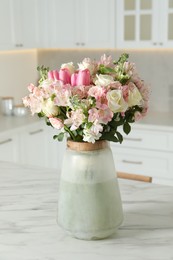 Beautiful bouquet of fresh flowers in vase on table indoors