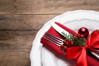 Photo of Beautiful Christmas table setting on wooden background, closeup