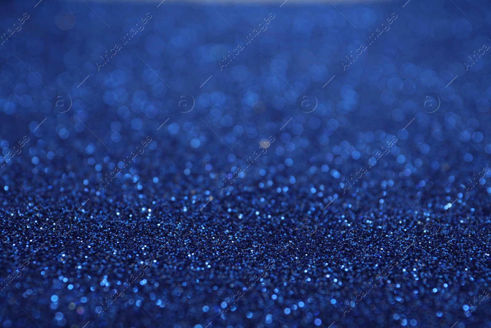 Photo of Shiny blue glitter as background. Bokeh effect