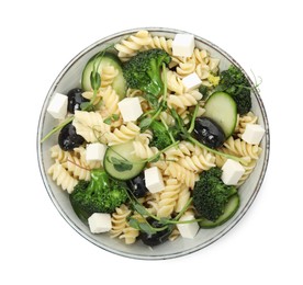 Bowl of delicious pasta with cucumber, olives, broccoli and cheese on white background, top view