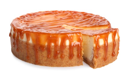 Photo of Sliced delicious cheesecake with caramel isolated on white