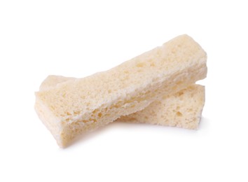 Photo of Crispy rusks on white background. Tasty snack