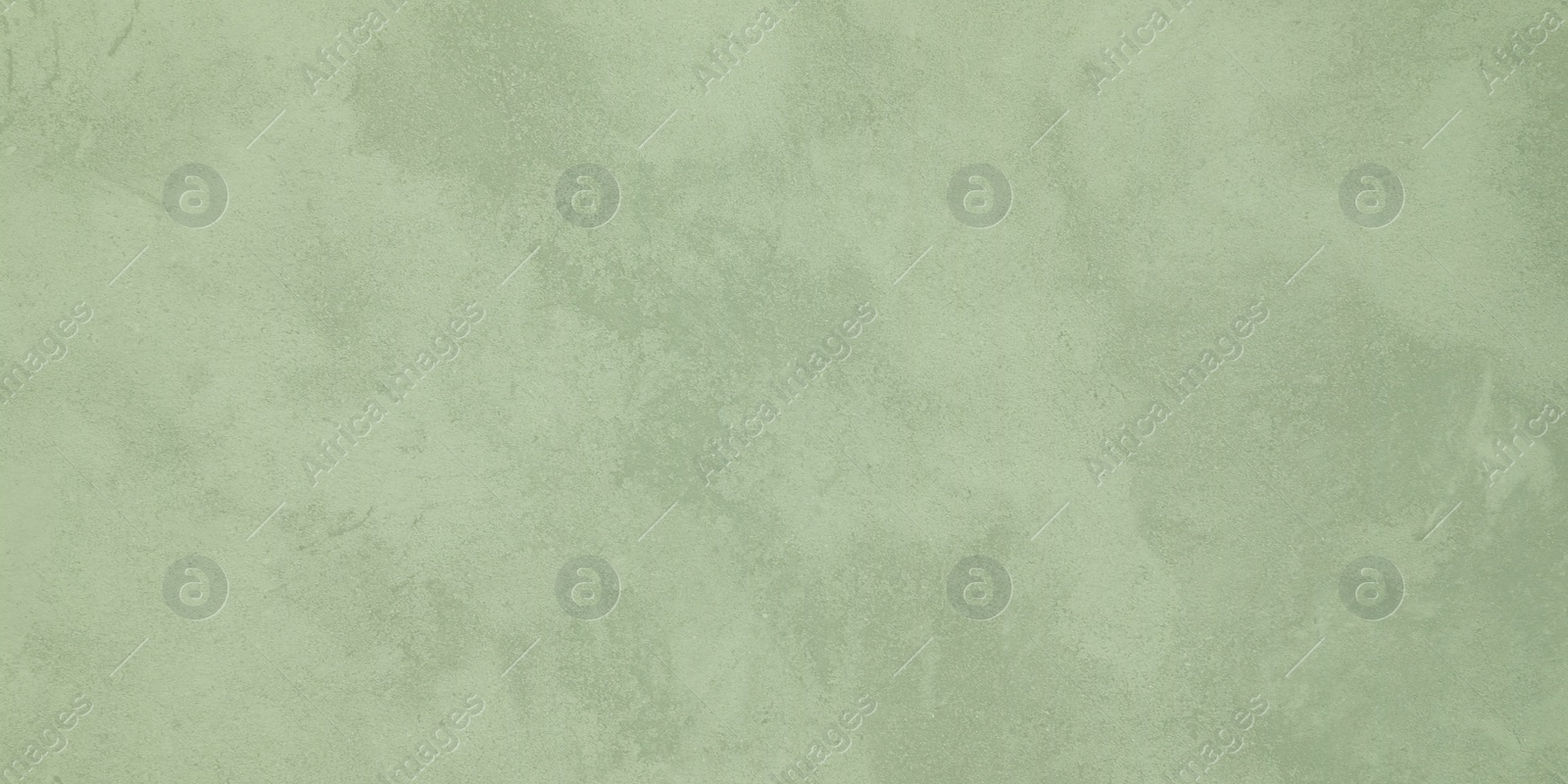 Image of Wall paper design. Light green textured concrete surface as background