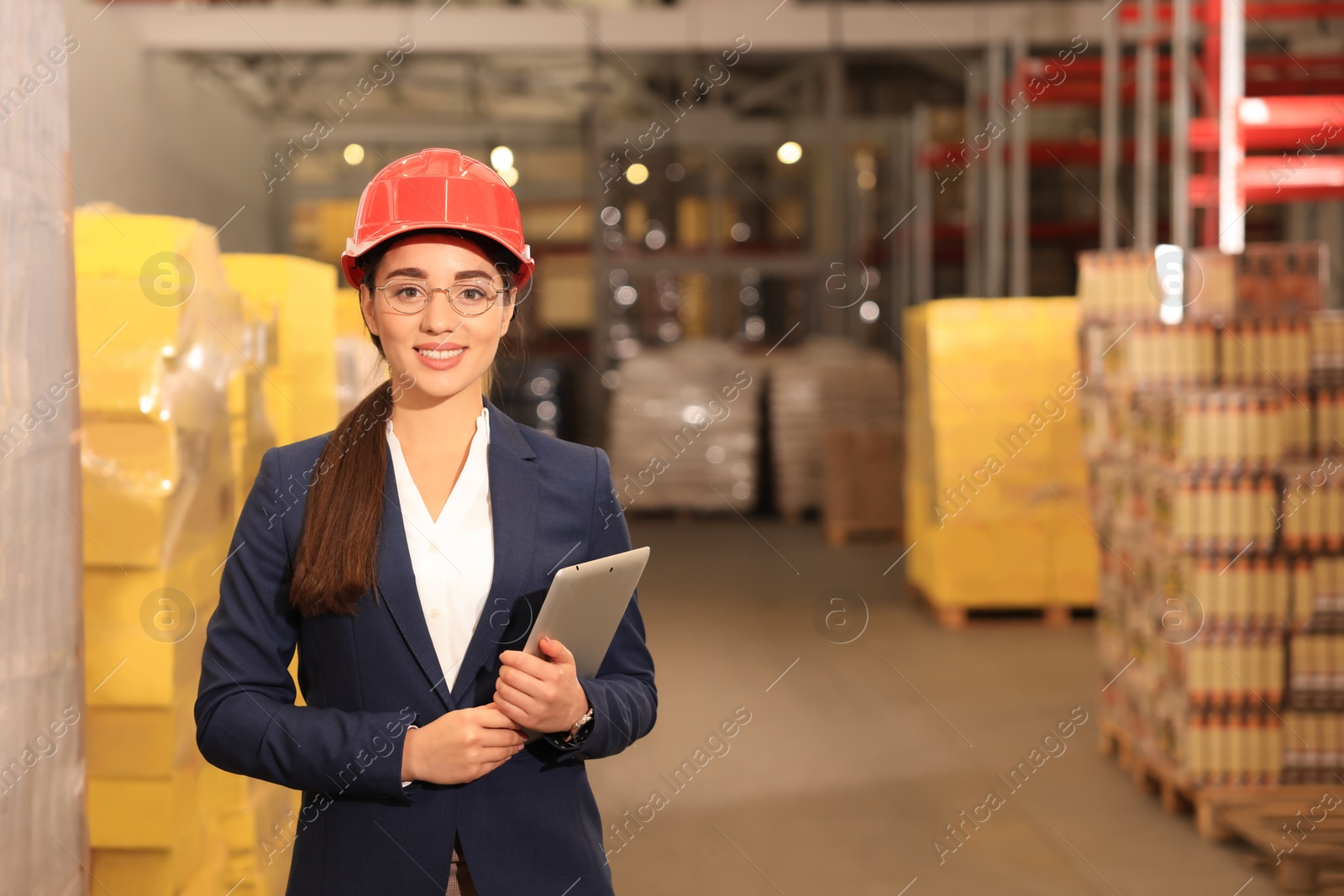 Image of Manager with tablet working at warehouse. Logistics center