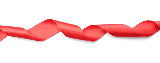 Photo of Simple red ribbon on white background, top view