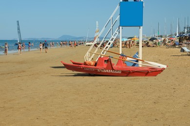 Photo of Rescue boat near watch tower on beach