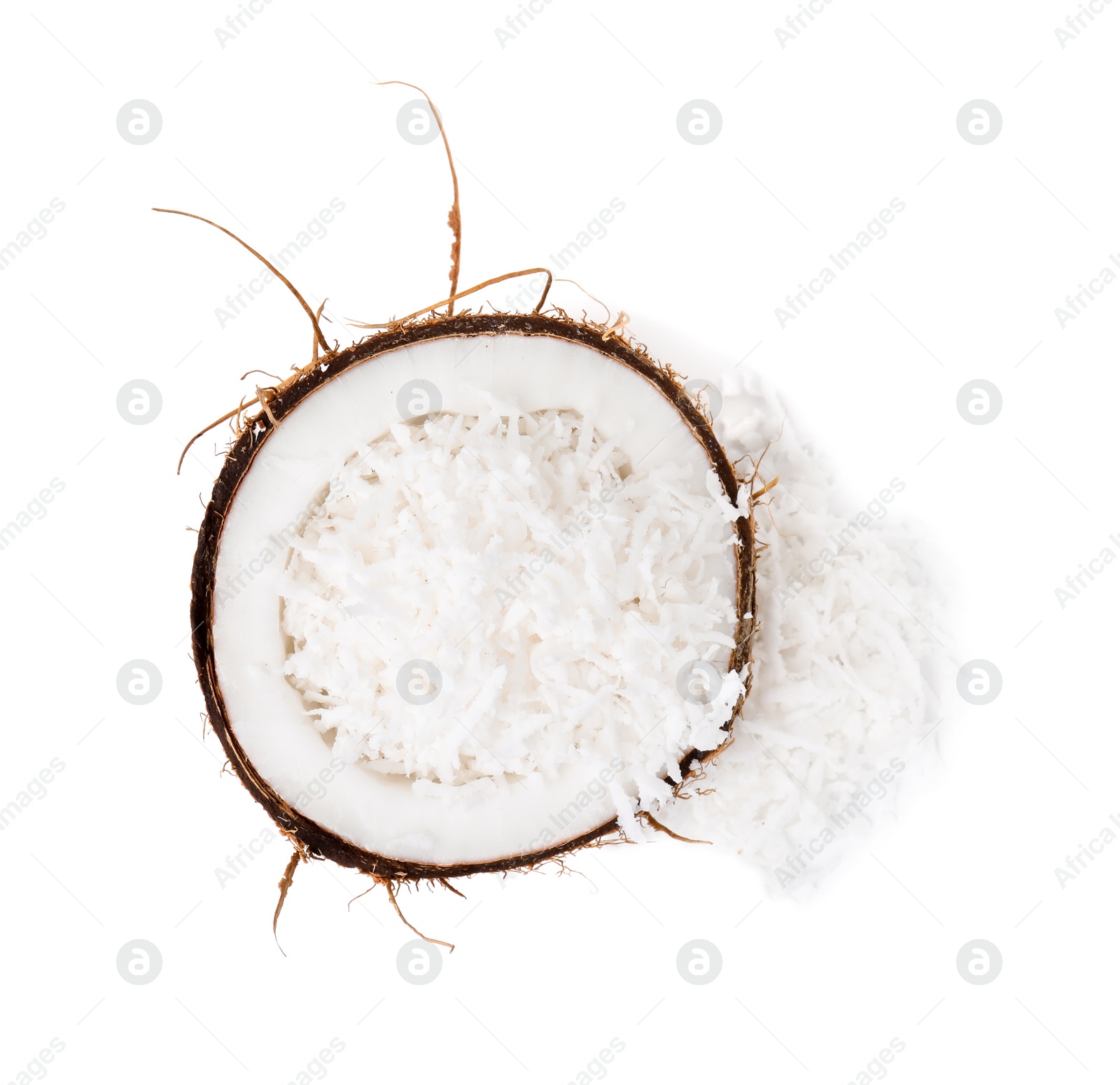 Photo of Coconut flakes in nut shell isolated on white, top view