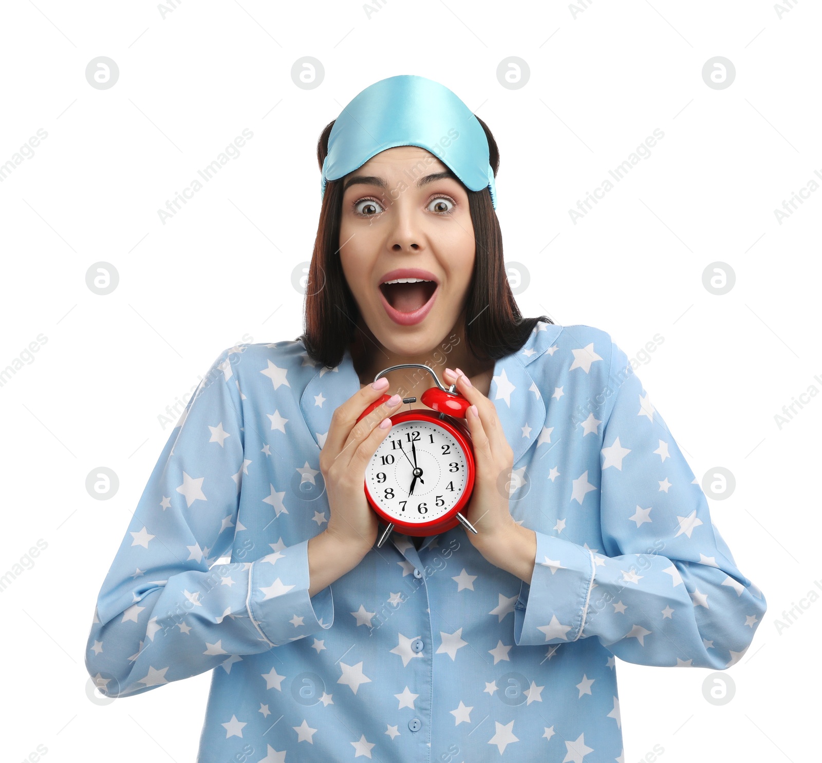 Photo of Emotional overslept woman with alarm clock on white background. Being late concept