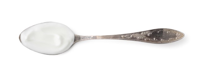 Photo of Delicious natural yogurt in spoon isolated on white, top view
