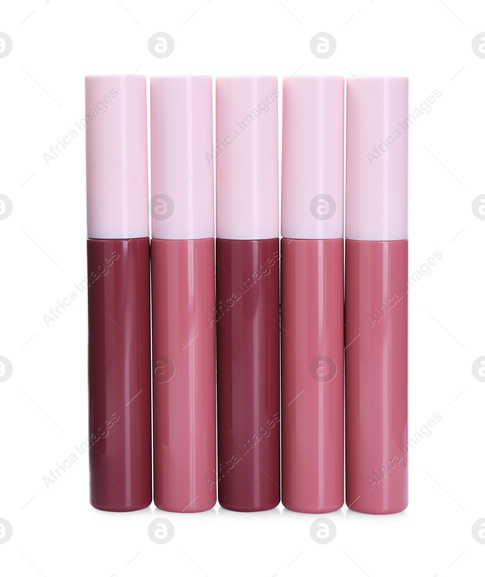 Photo of Many bright lip glosses isolated on white