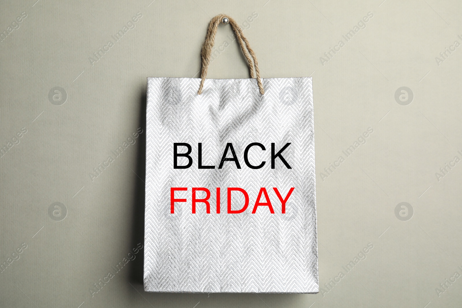 Image of Shopping bag with text BLACK FRIDAY on grey background