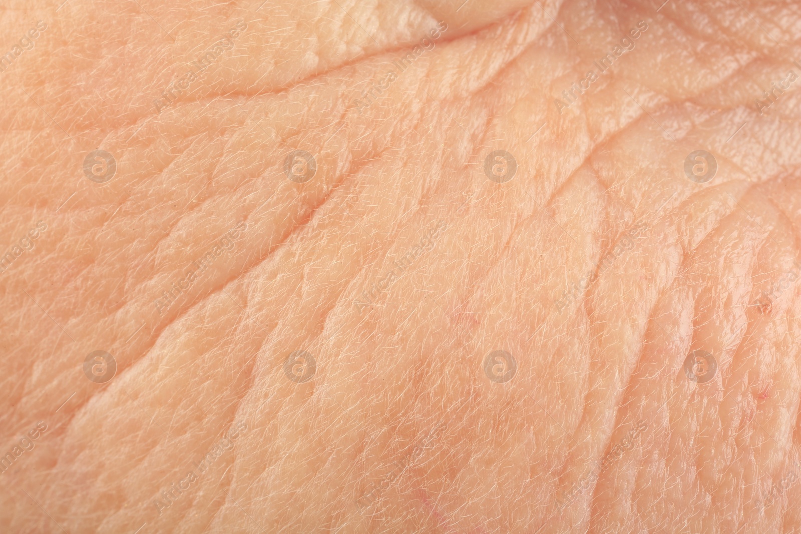 Photo of Texture of human skin with wrinkles as background, macro view