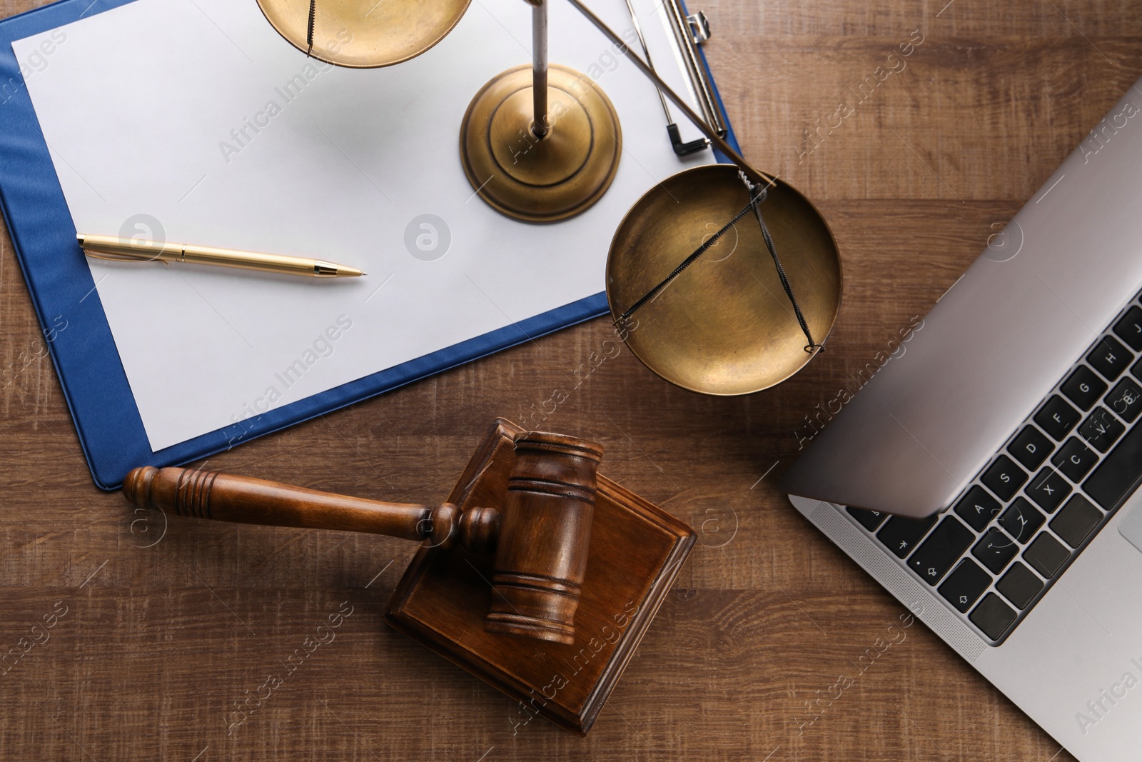 Photo of Law concept. Flat lay composition with scales of justice and mallet on wooden table