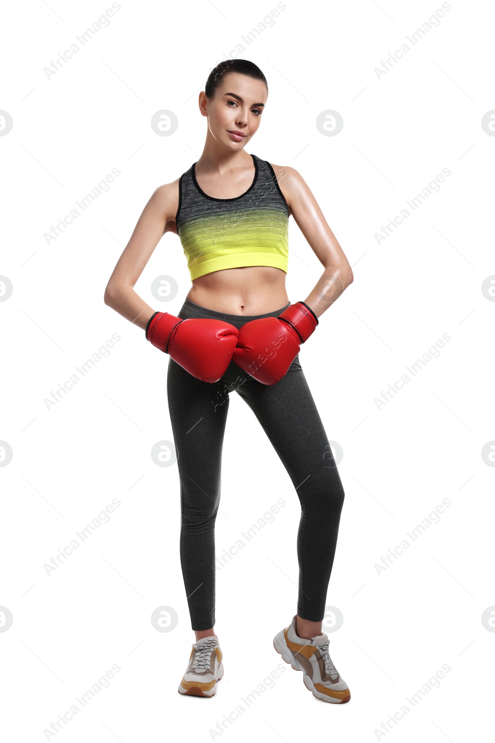 Photo of Beautiful woman in boxing gloves on white background