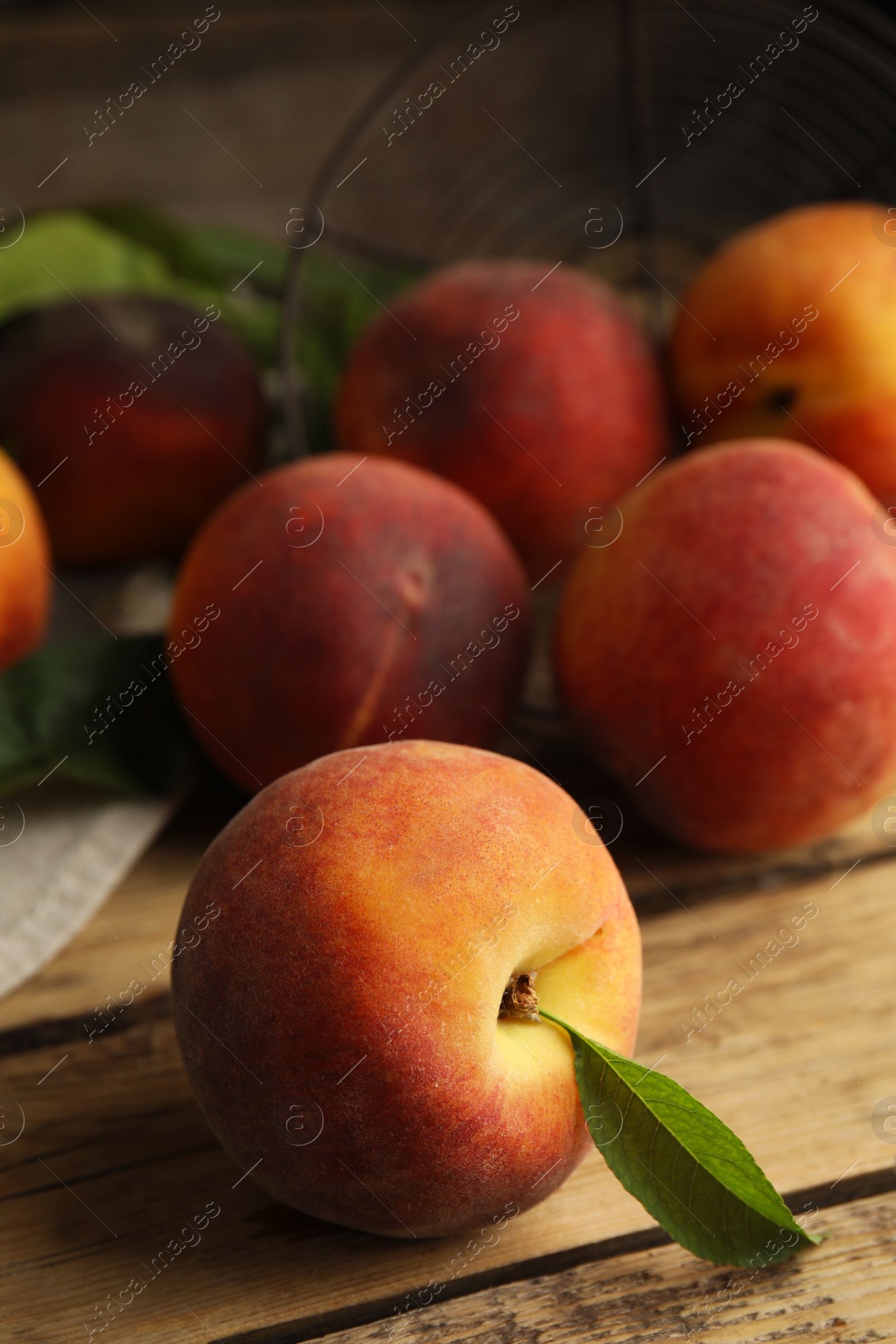 Photo of Fresh ripe juicy peaches on wooden table, closeup