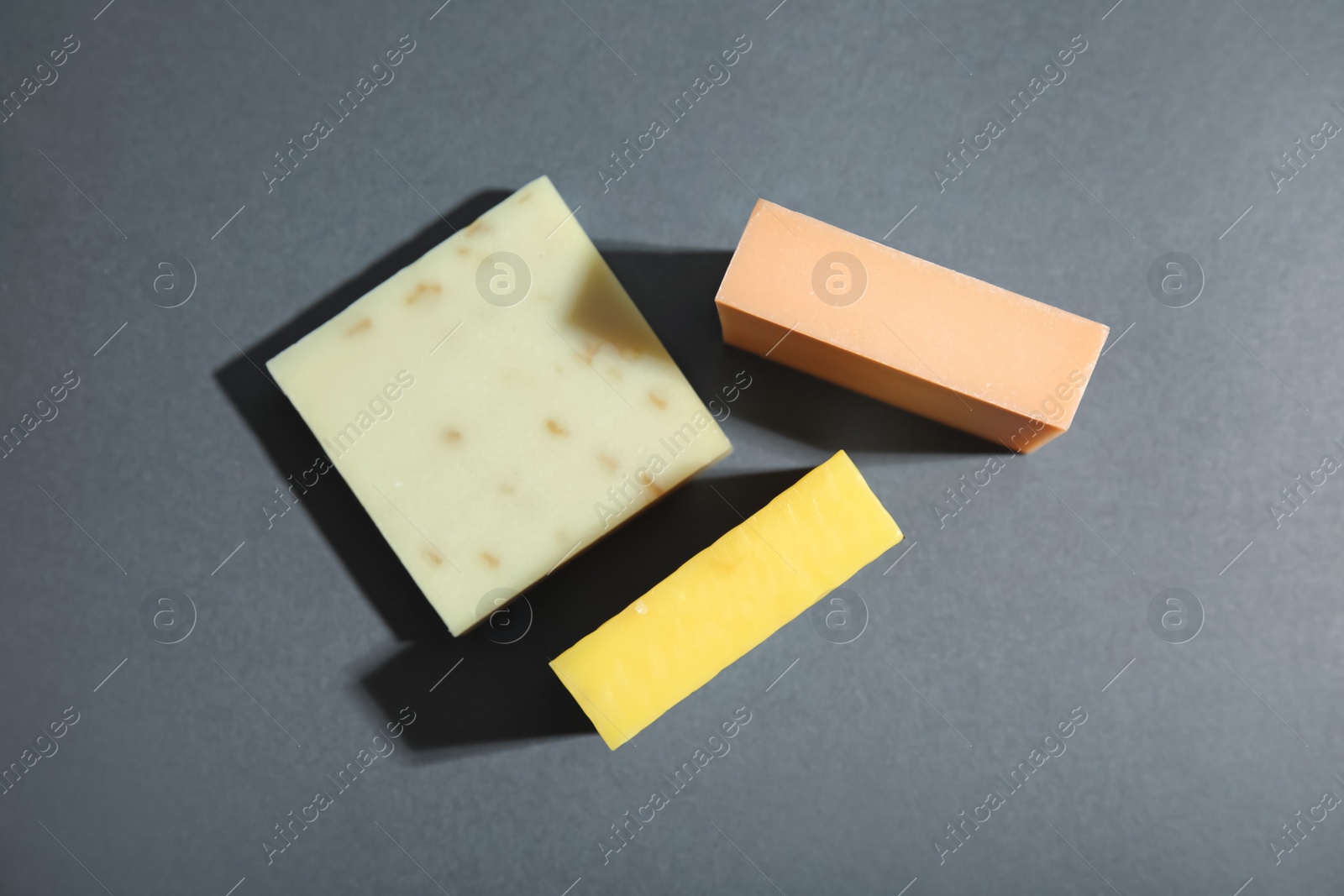 Photo of Hand made soap bars on grey background, top view