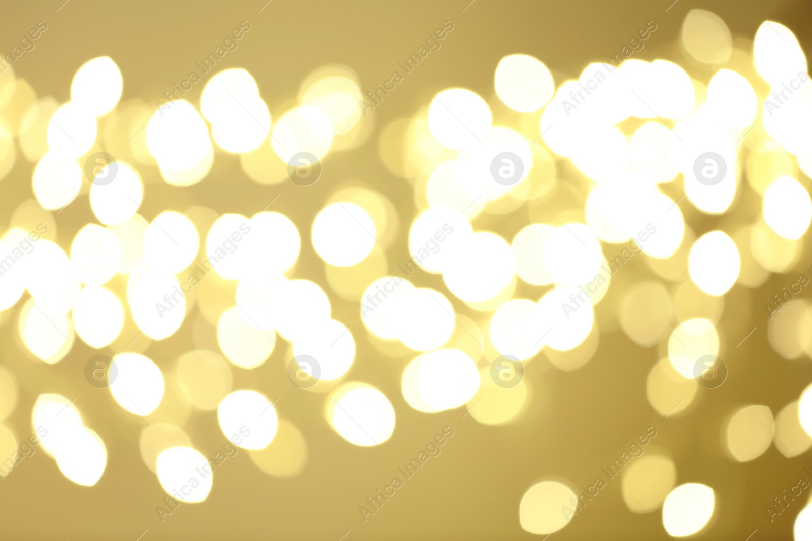 Photo of Beautiful golden lights as background. Bokeh effect