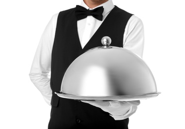 Waiter holding metal tray with lid on white background, closeup