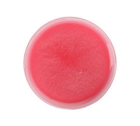 Red slime in plastic container isolated on white, top view. Antistress toy