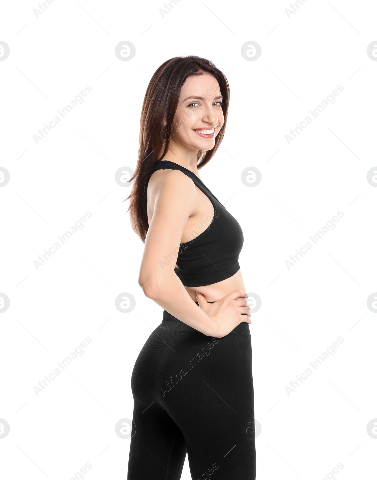 Photo of Happy young woman with slim body posing on white background