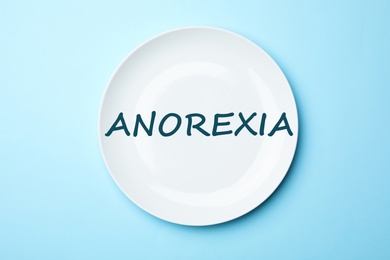 Image of Anorexia concept. ceramic plate on color background, top view