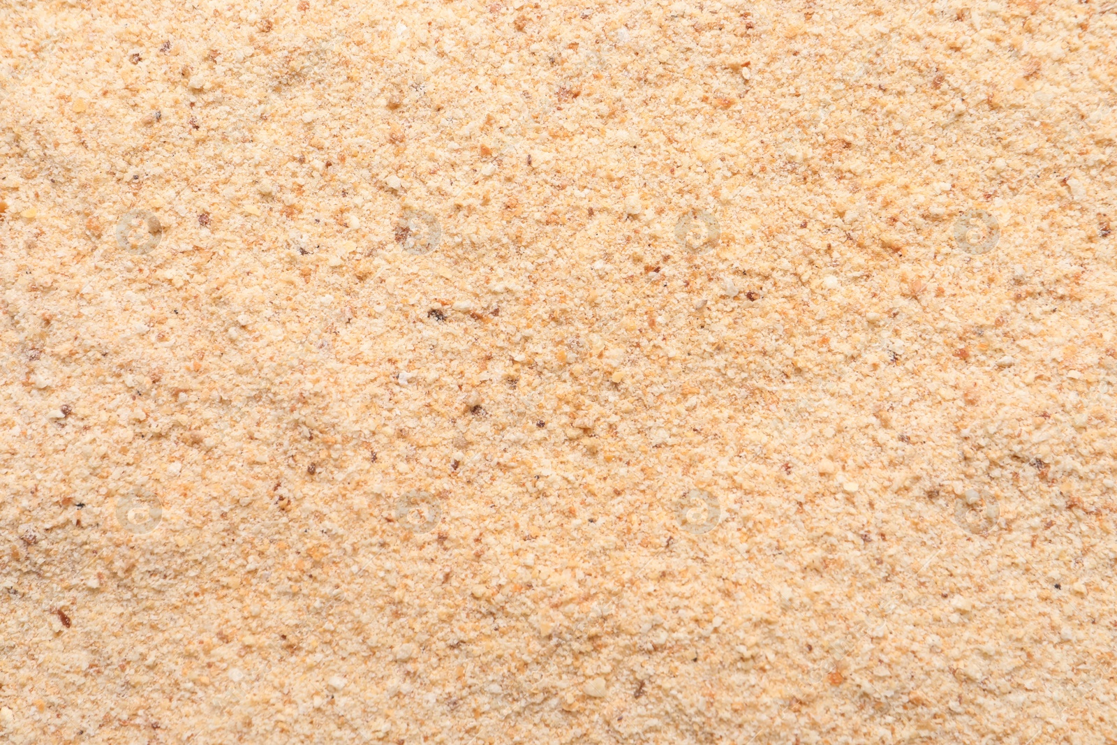 Photo of Pile of fresh bread crumbs as background, top view