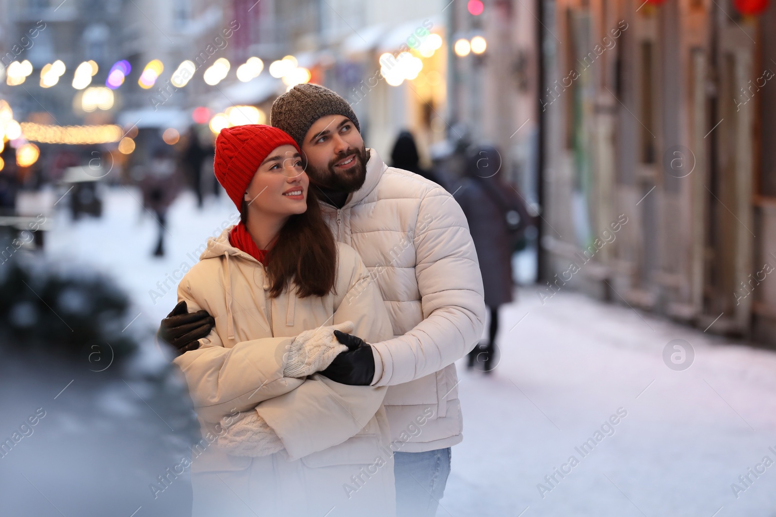 Photo of Lovely couple spending time together on city street