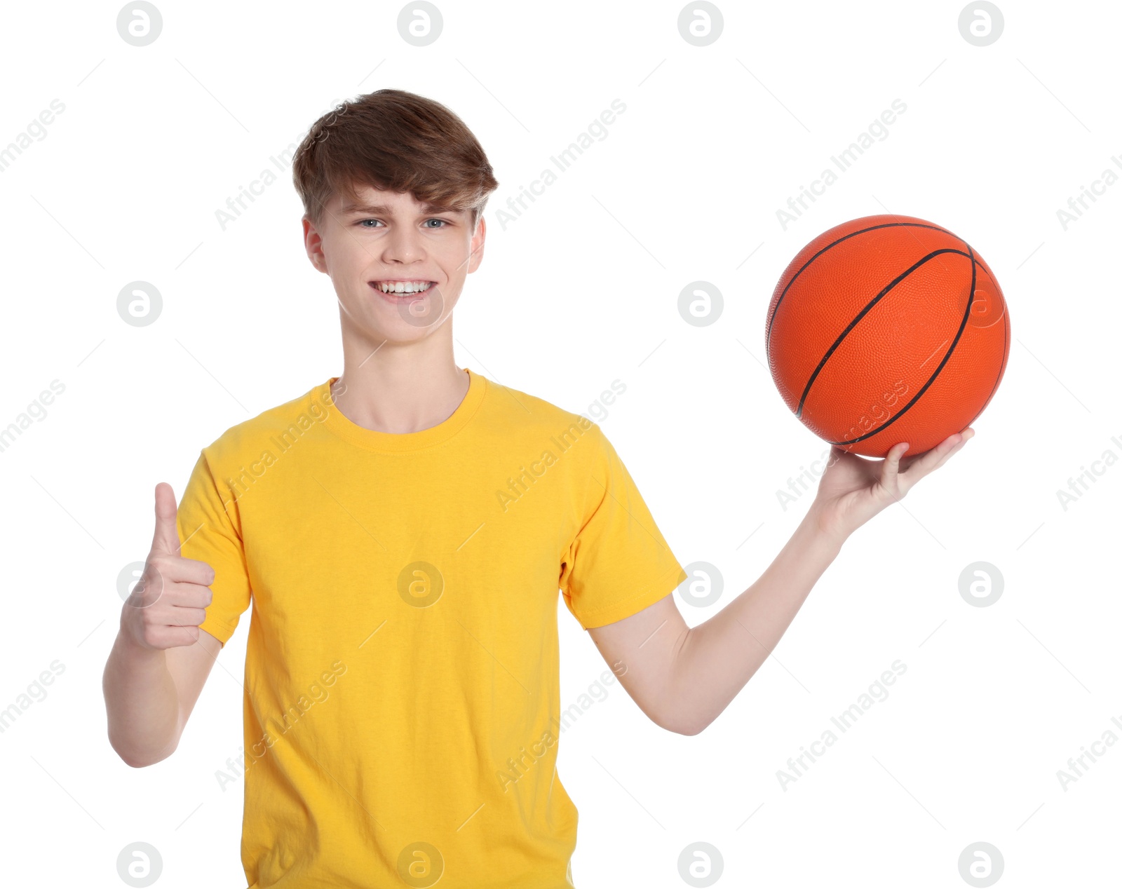 Photo of Teenage boy with basketball ball on white background