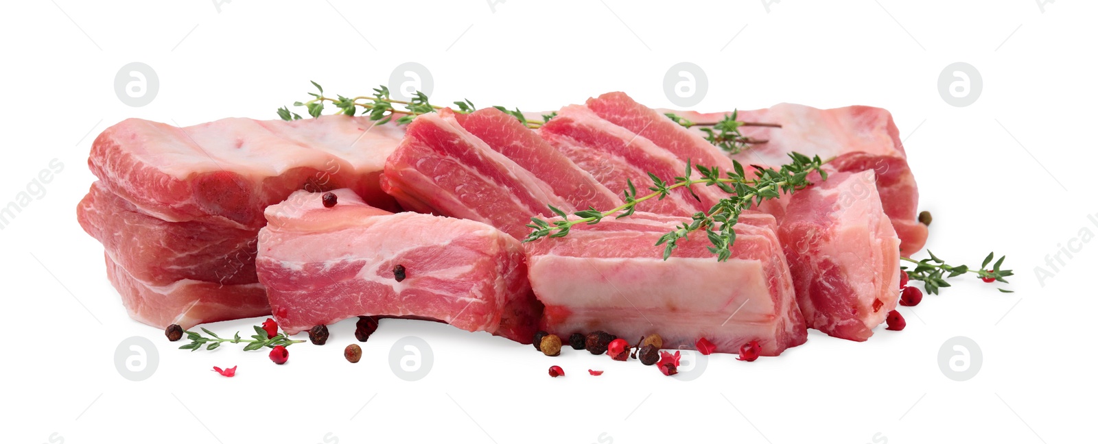 Photo of Fresh raw pork ribs with peppercorns and thyme isolated on white