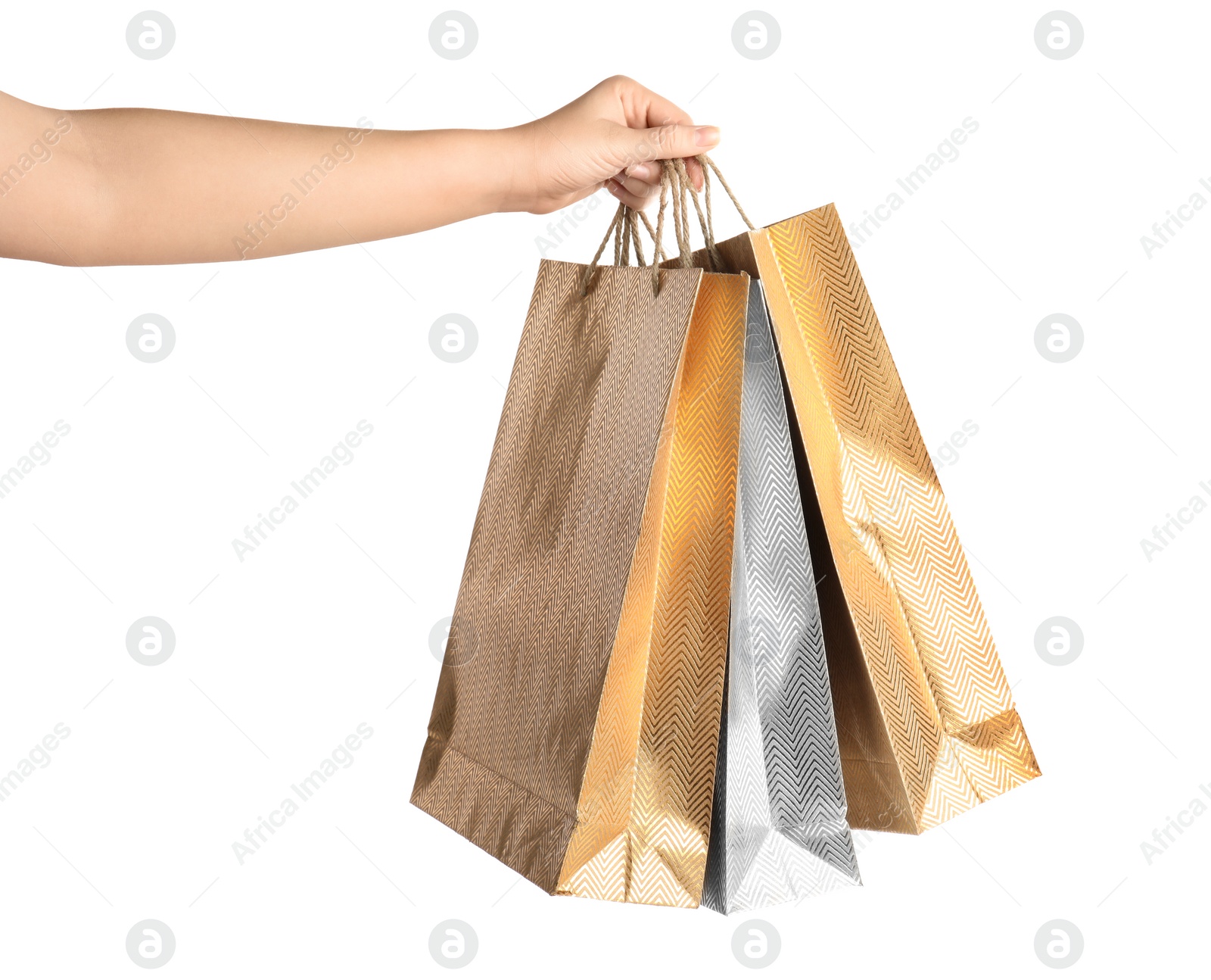 Photo of Woman holding paper shopping bags on white background, closeup. Space for design