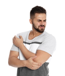 Man suffering from elbow pain on white background