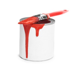 Can of red paint with brush on white background