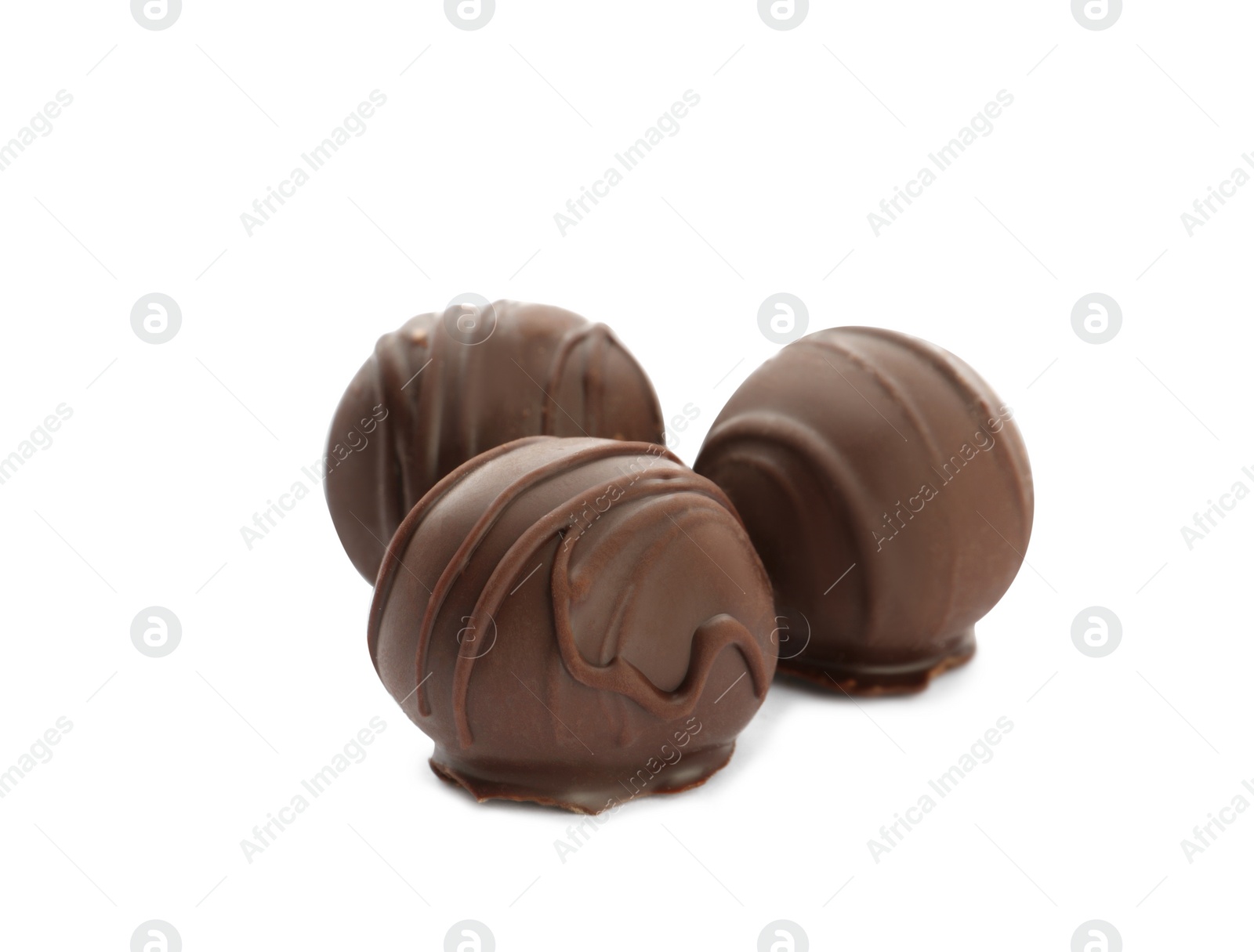 Photo of Delicious sweet chocolate truffles on white background