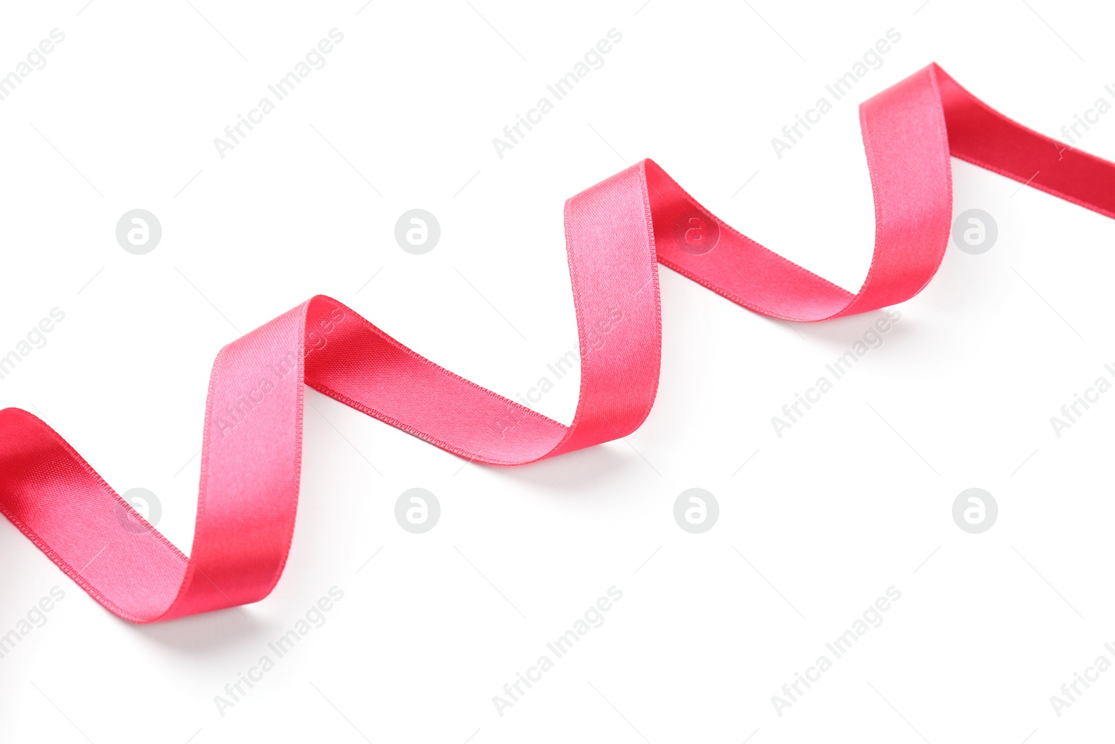 Photo of Simple pink ribbon on white background. Festive decoration