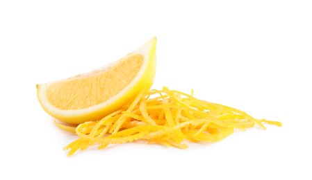 Photo of Grated lemon zest and fresh fruit on white background