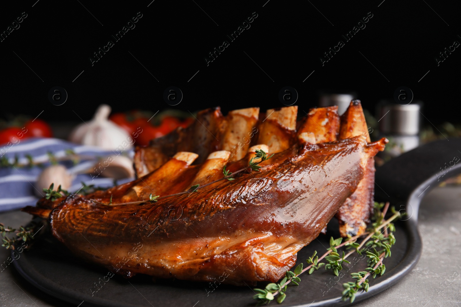 Photo of Delicious roasted ribs served on plate, closeup