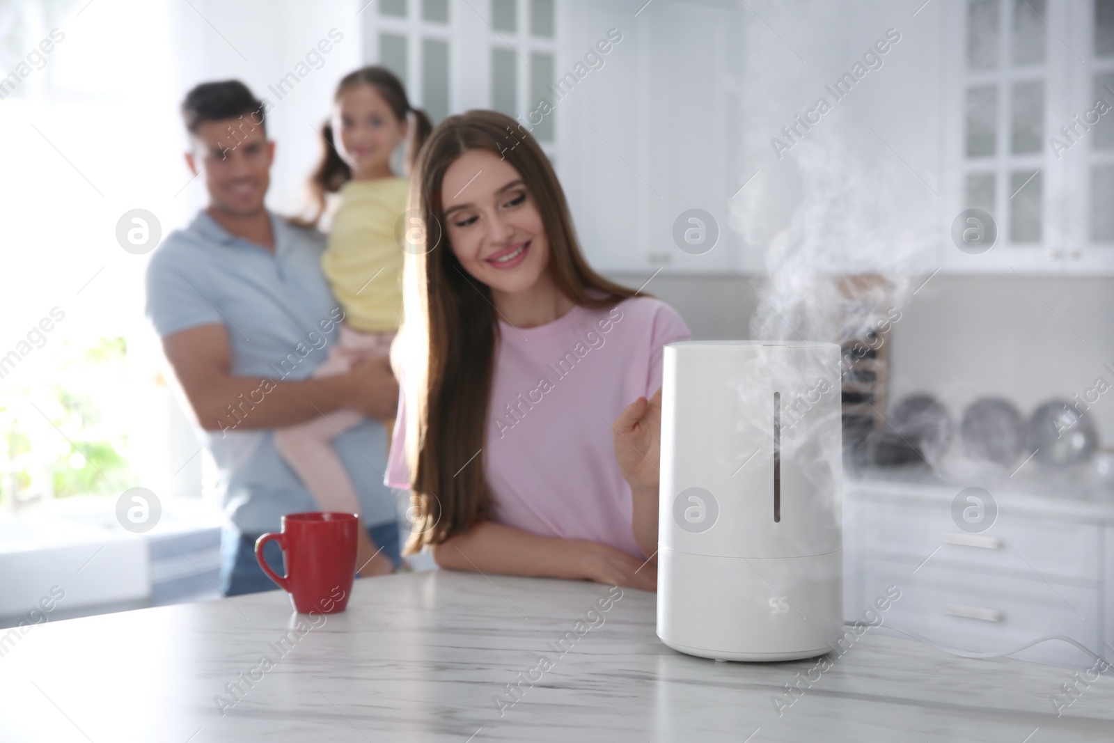 Photo of Family in kitchen with modern air humidifier