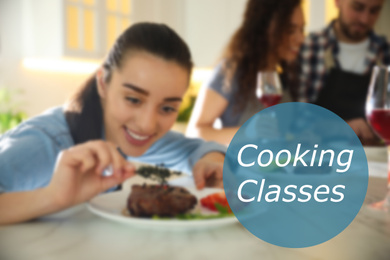 Cooking classes. Blurred view of young woman serving food in kitchen