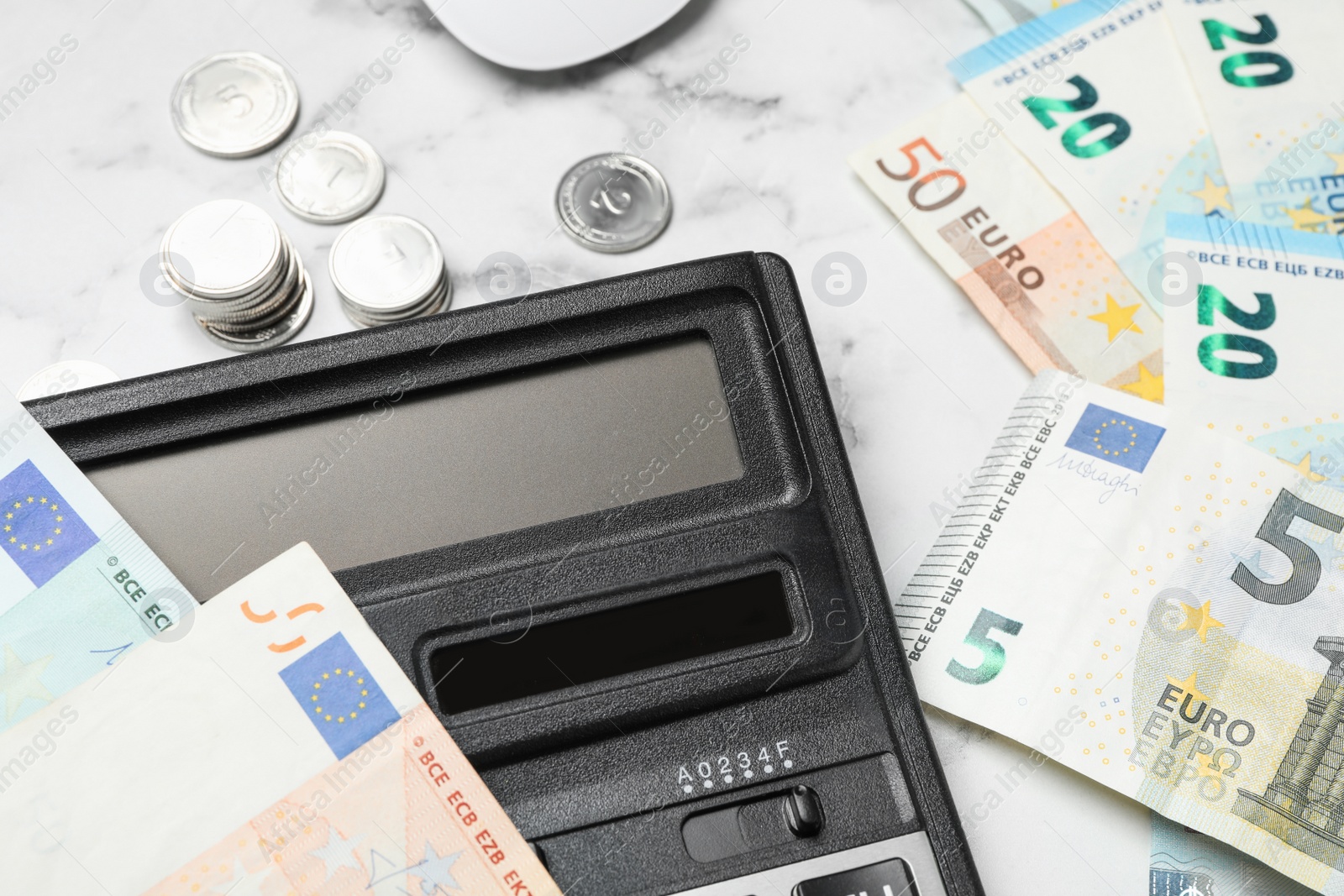 Photo of Calculator and money on marble background, closeup. Tax accounting