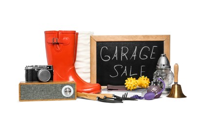 Photo of Sign Garage Sale written on blackboard near many different stuff isolated on white
