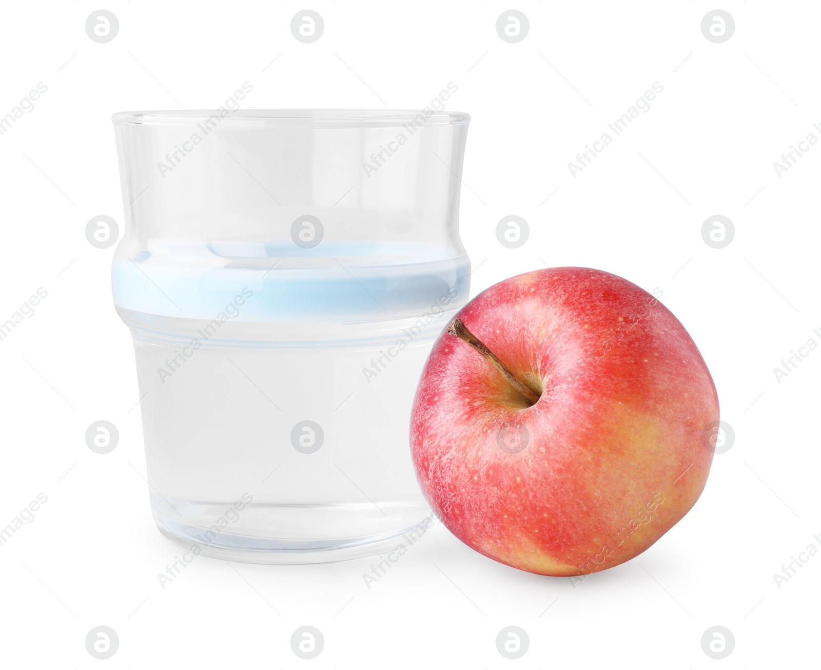 Photo of Glass with sweet fructose syrup and ripe apple on white background