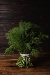 Bunch of fresh green dill on wooden table