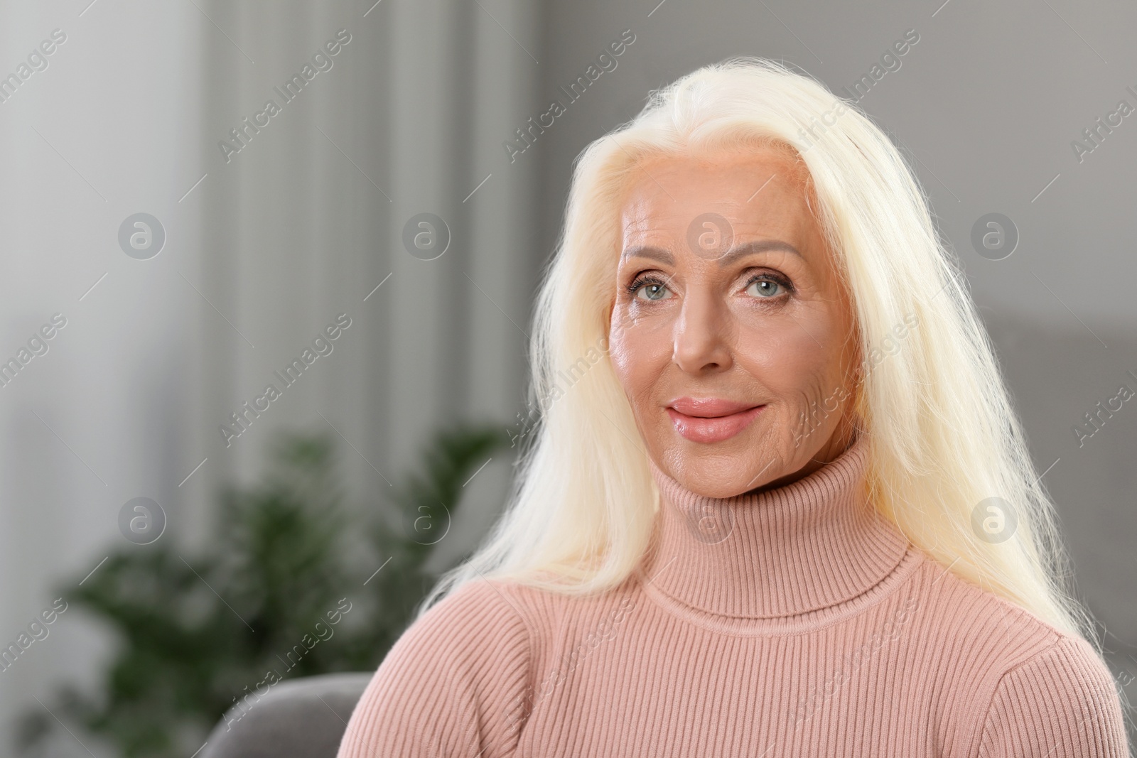 Photo of Portrait of elegant mature woman at home