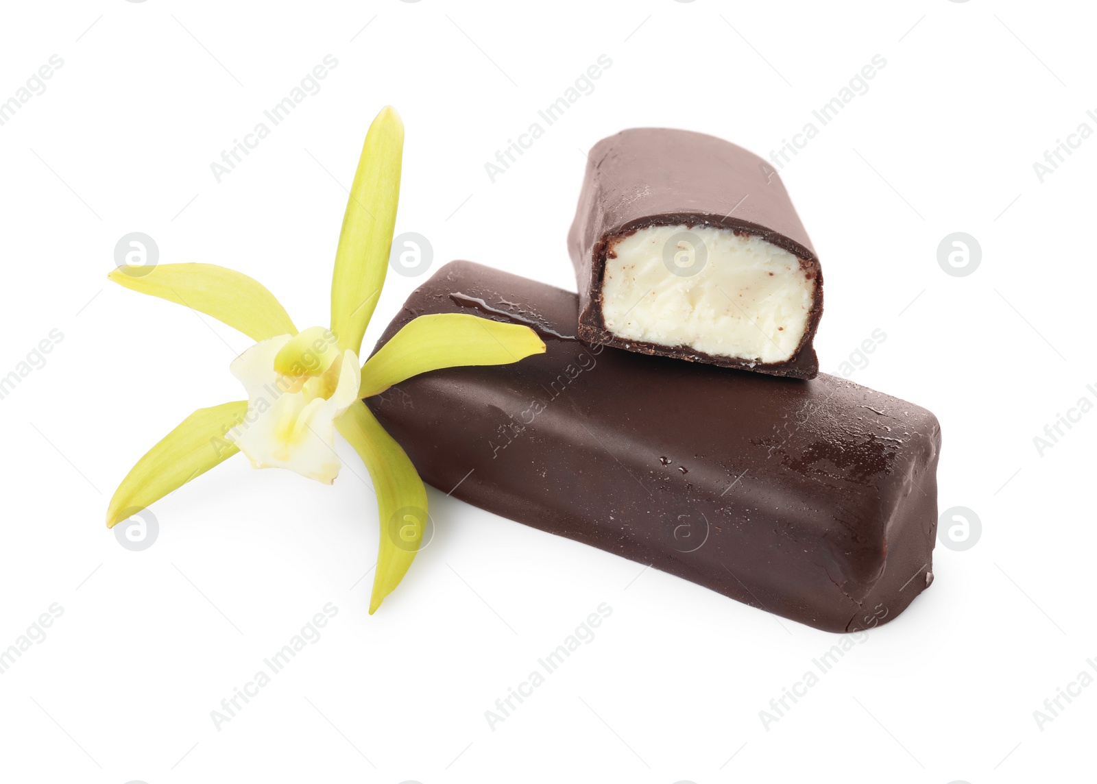 Photo of Glazed curd cheese bars and vanilla flower isolated on white