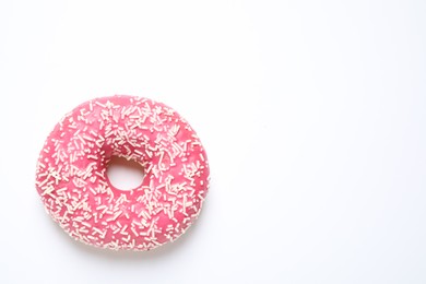 Delicious glazed donut on white background, top view. Space for text