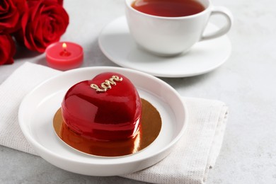 St. Valentine's Day. Delicious heart shaped cake served on light table, closeup