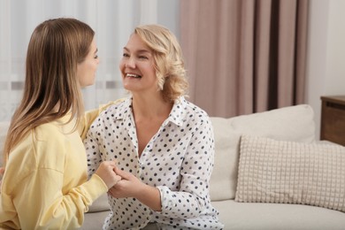 Young woman with her mom at home. Happy Mother's Day