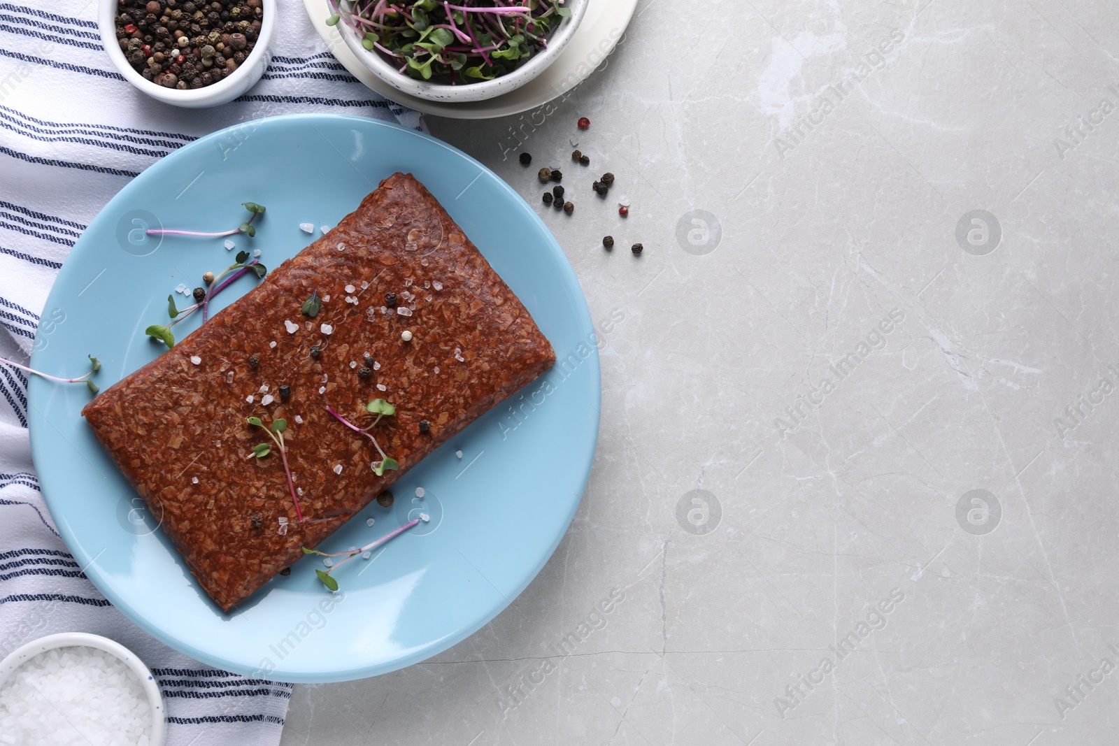 Photo of Fresh raw vegan mince with spices on light grey marble table, flat lay. Space for text